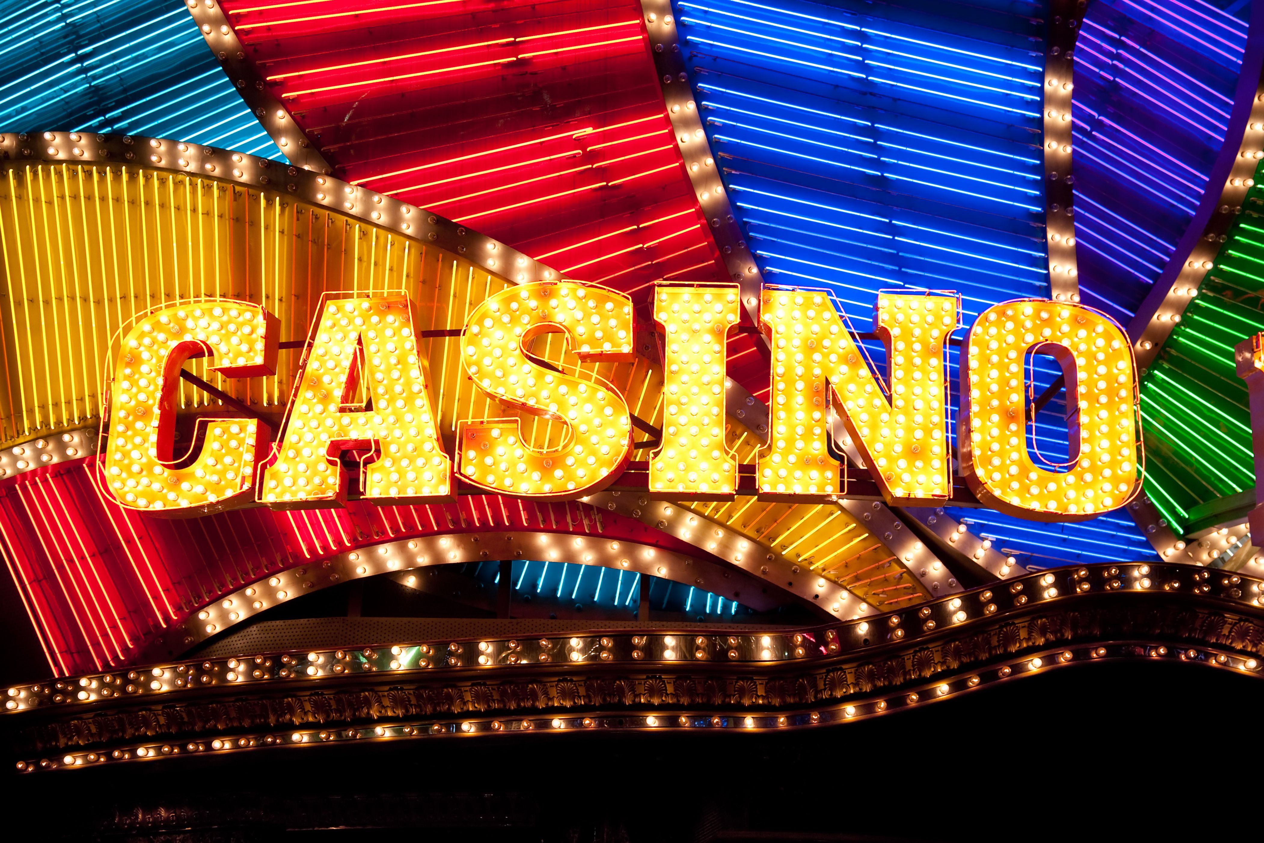 A vibrant graphic showcasing the Scatter Slots logo with fantasy characters and gold coins.